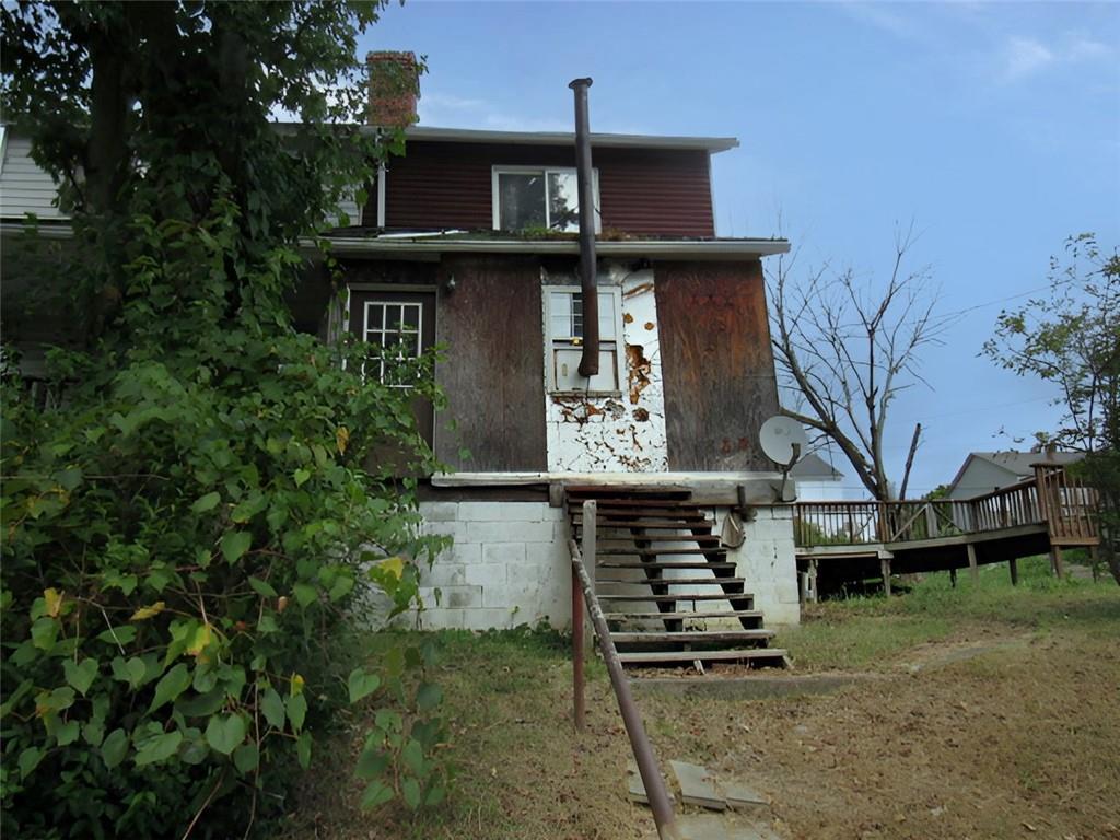 128 Shoaf Road Smithfield, PA 15478 - Photo 2 of 12 a front view of house with a garden