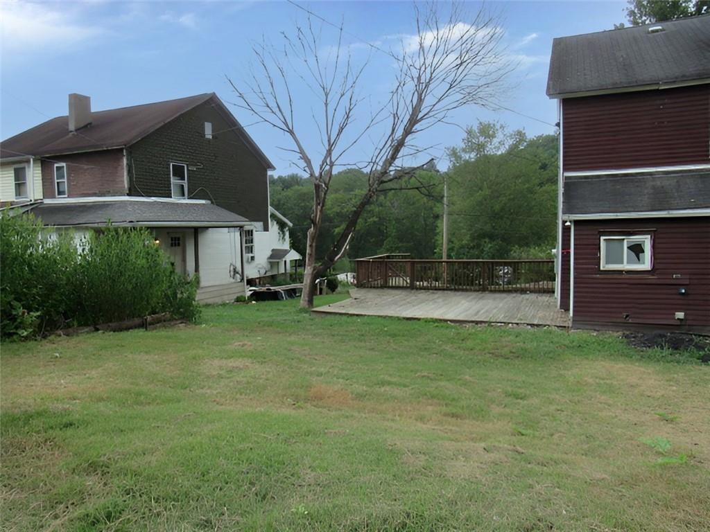 128 Shoaf Road Smithfield, PA 15478 - Photo 3 of 12 a front view of a house with garden