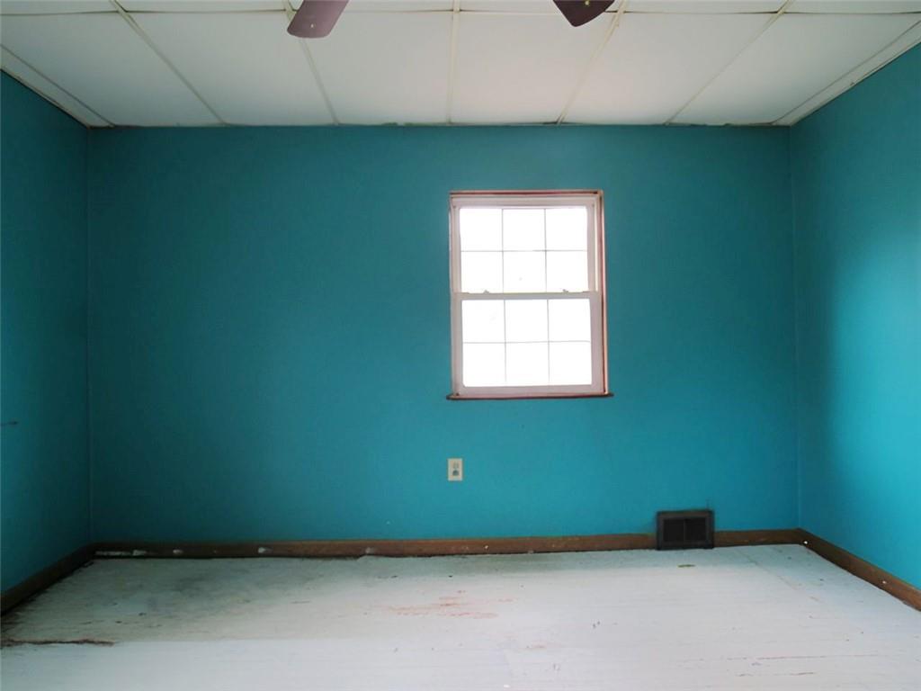 128 Shoaf Road Smithfield, PA 15478 - Photo 9 of 12 a view of an empty room with a window