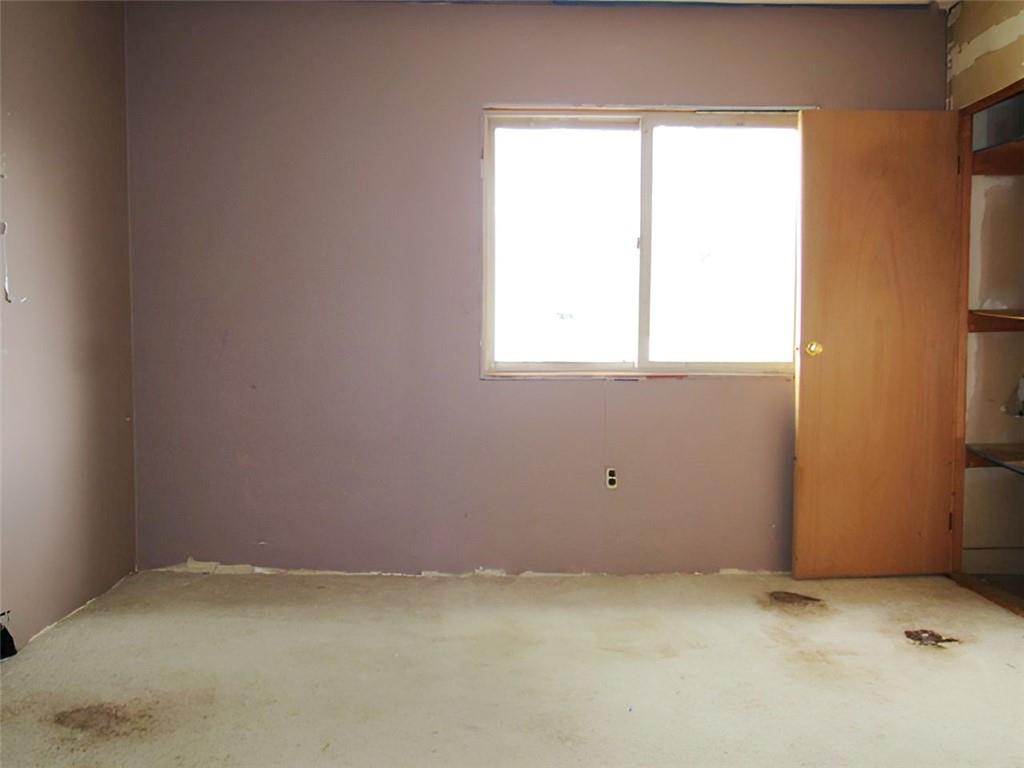 128 Shoaf Road Smithfield, PA 15478 - Photo 10 of 12 an empty room with a window