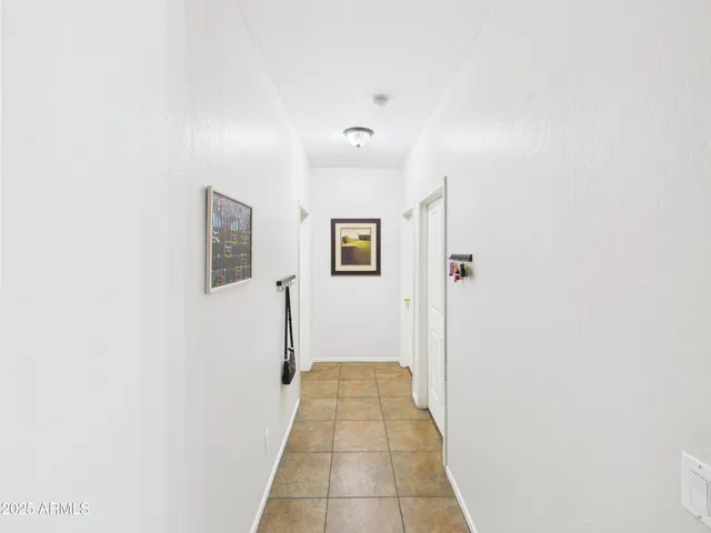 a view of a hallway with a white walls