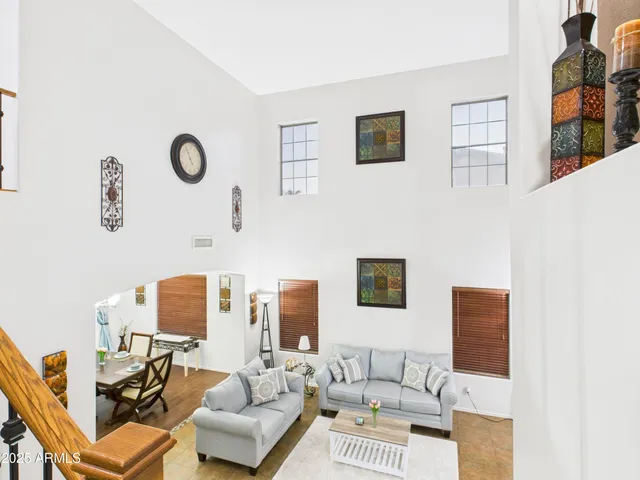 a living room with furniture and a table