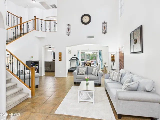 a living room with furniture and white walls