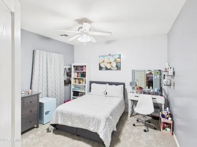 a bedroom with a bed and furniture