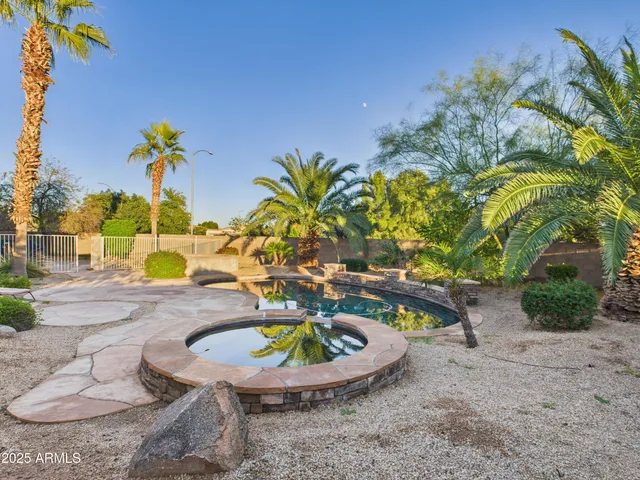 a view of a swimming pool with a back yard