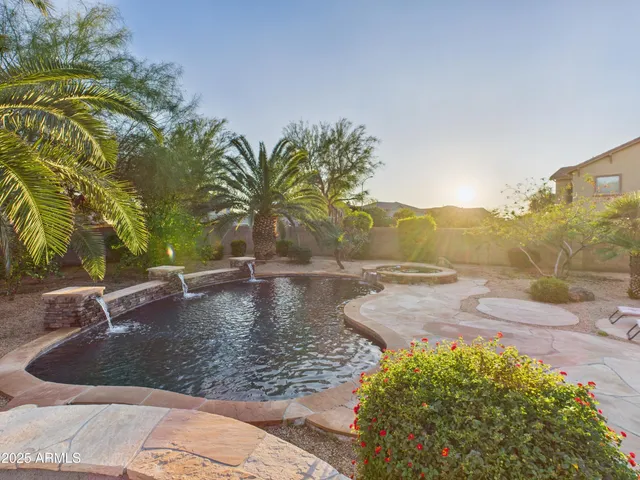 a view of a swimming pool with a yard