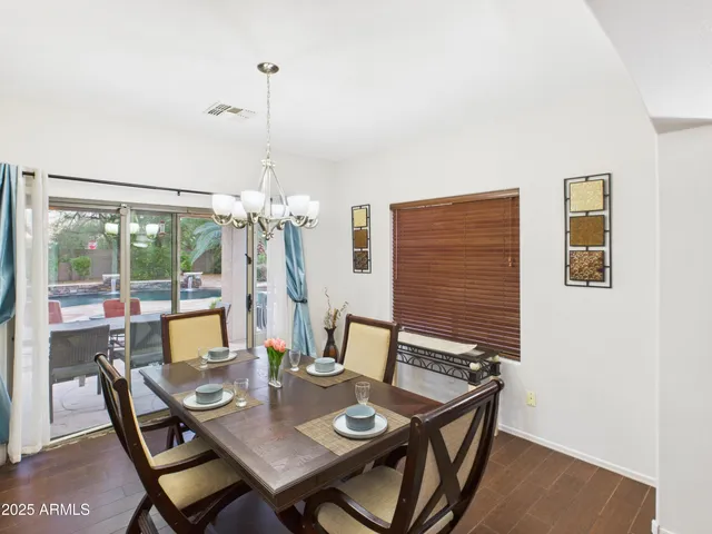 a view of a dining room with furniture window and outside view