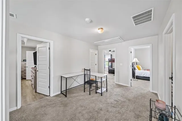 a bedroom with a bed and a couch