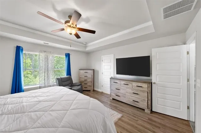 a view of walk in closet with clothes