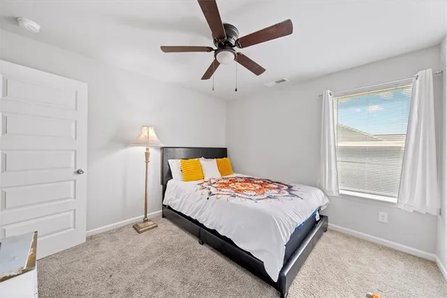 a bedroom with a bed and dresser