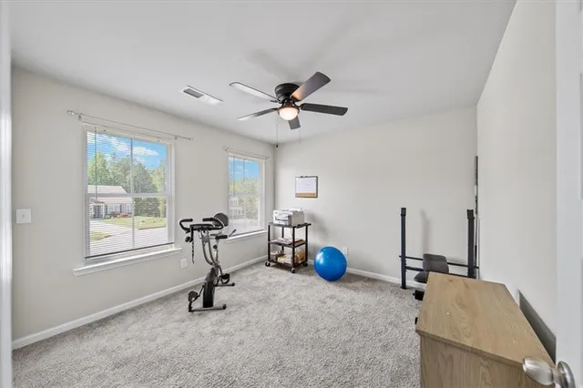 a utility room with dryer washer and empty racks