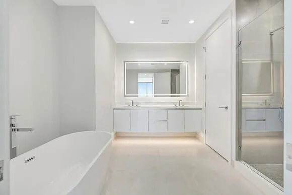 a bathroom with a bathtub and a sink
