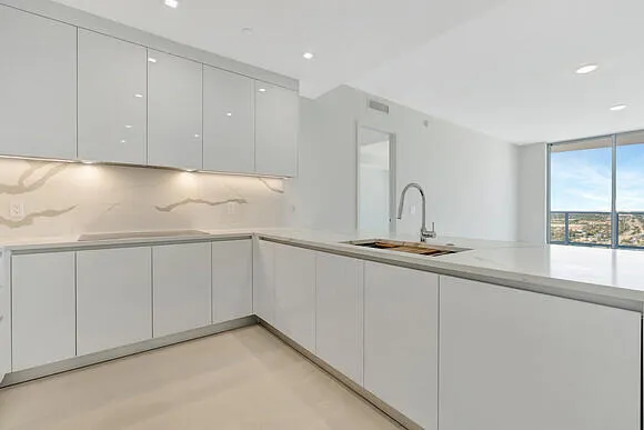 a kitchen with a sink and cabinets