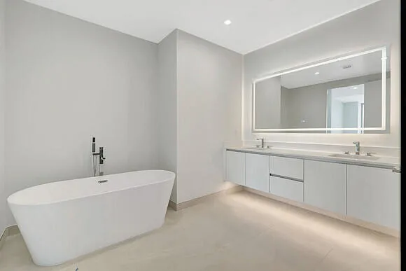 a bathroom with a bathtub and a sink