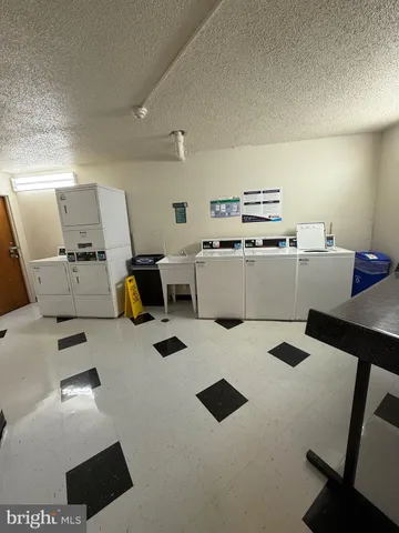a kitchen with furniture and view of kitchen