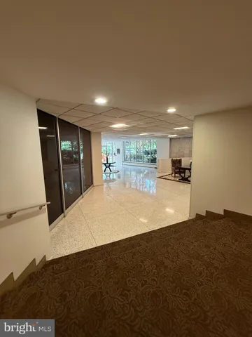 a view of kitchen with refrigerator stove microwave and cabinets