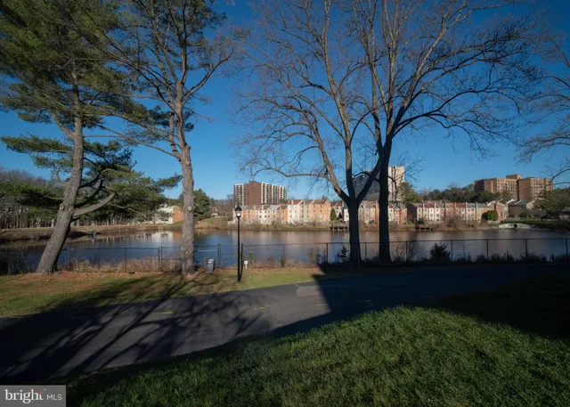 a view of a back yard of the house and green space