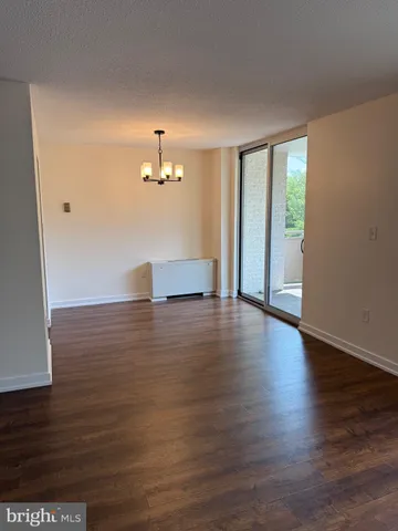 a view of a livingroom with wooden floor