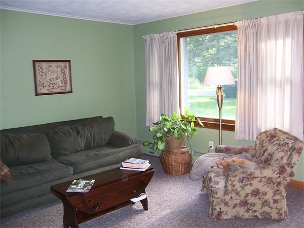 93 Ponakin Road Lancaster, MA 01523 - Photo 4 of 24 a living room with furniture and a large window