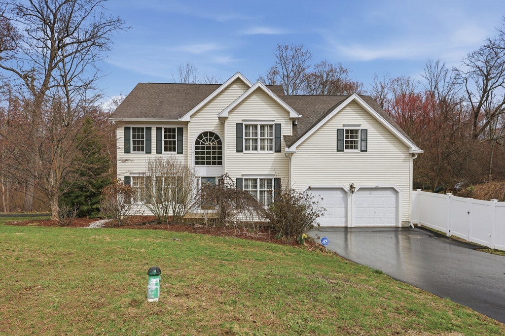 35 Peter Street Holliston, MA 01746 - Photo 1 of 42 a view of a house with a yard