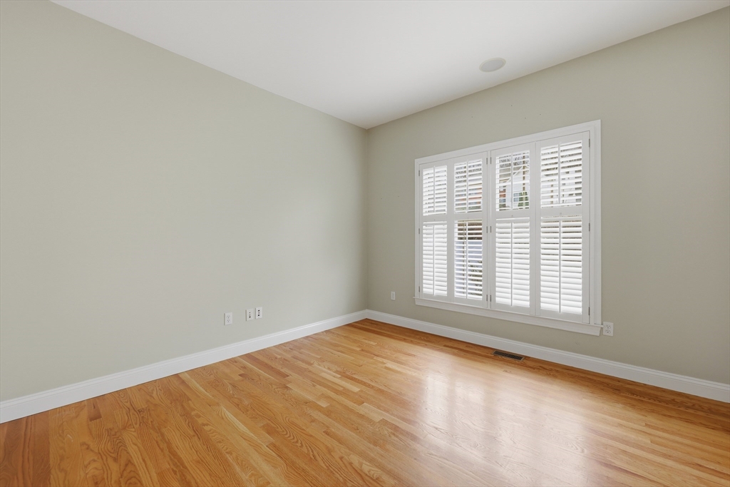35 Peter Street Holliston, MA 01746 - Photo 14 of 42 a view of an empty room with wooden floor and a window