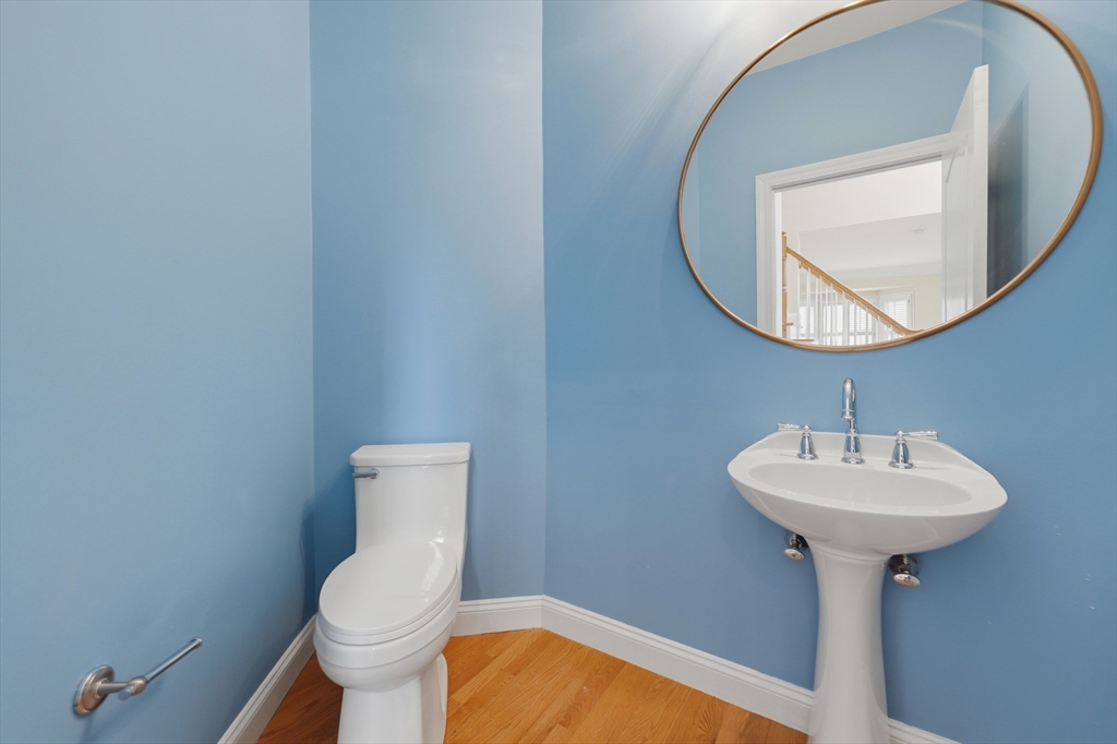 35 Peter Street Holliston, MA 01746 - Photo 18 of 42 a bathroom with a sink a mirror and toilet