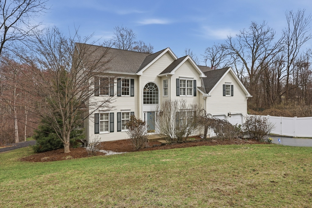 35 Peter Street Holliston, MA 01746 - Photo 2 of 42 a front view of a house with a yard