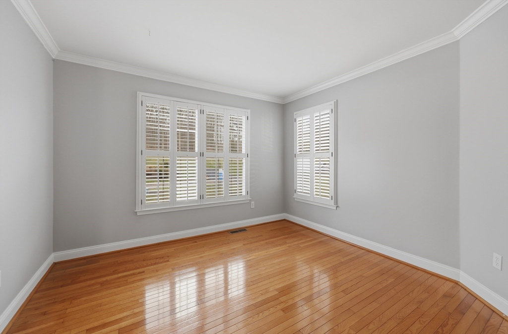 35 Peter Street Holliston, MA 01746 - Photo 21 of 42 a view of an empty room with wooden floor and a window