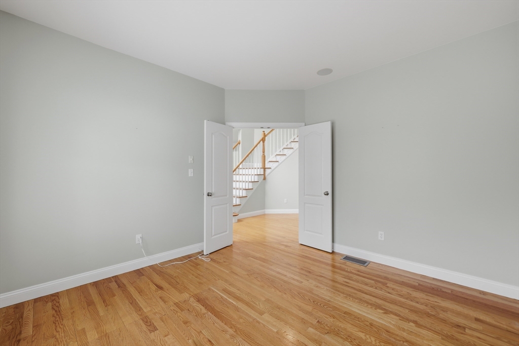 35 Peter Street Holliston, MA 01746 - Photo 22 of 42 a view of empty room with wooden floor