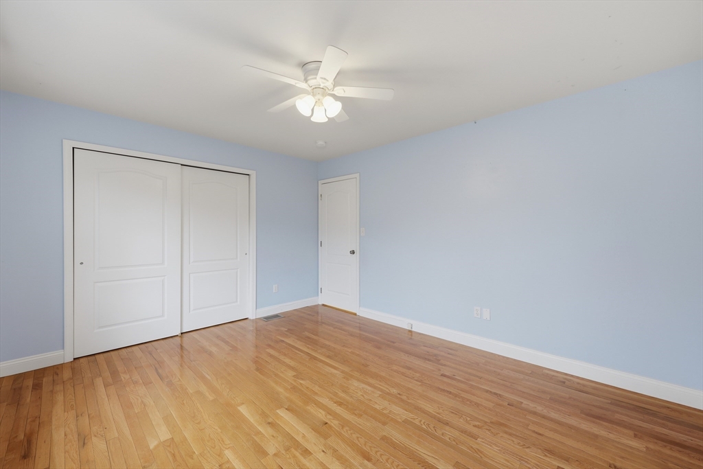 35 Peter Street Holliston, MA 01746 - Photo 33 of 42 a view of an empty room with wooden floor