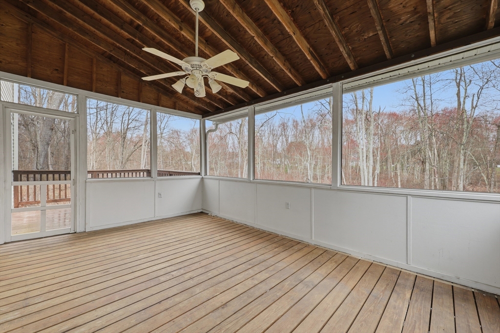35 Peter Street Holliston, MA 01746 - Photo 37 of 42 a view of an empty room with wooden floor and a window