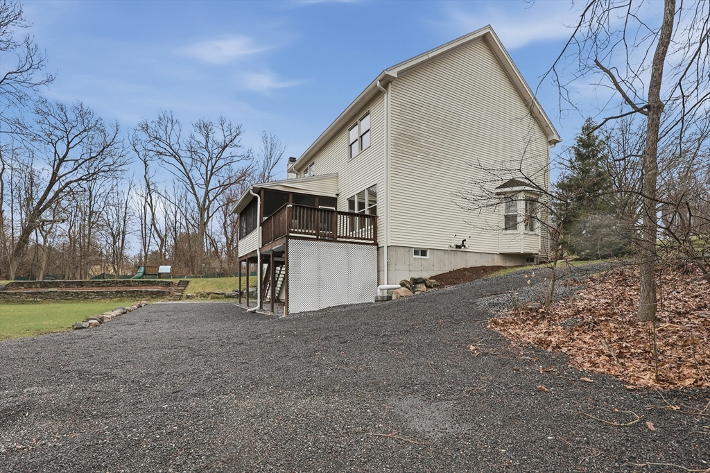 35 Peter Street Holliston, MA 01746 - Photo 40 of 42 a view of a house with a yard