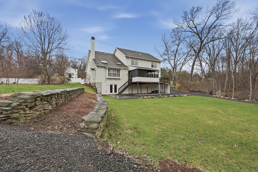 35 Peter Street Holliston, MA 01746 - Photo 42 of 42 a house view with a play ground in front of it