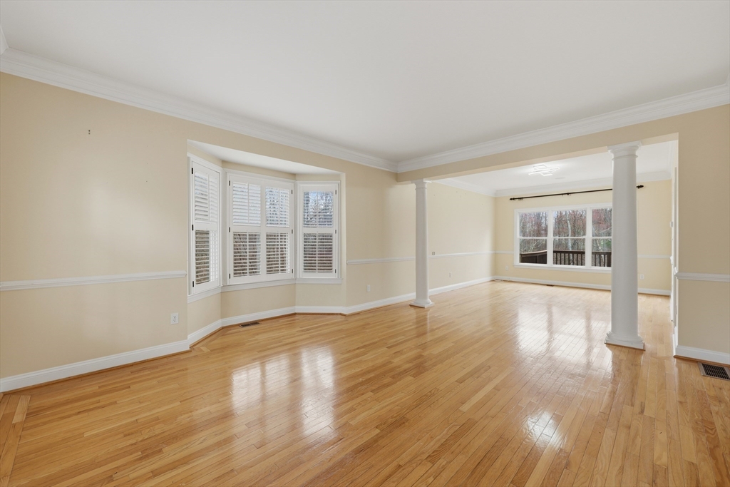 35 Peter Street Holliston, MA 01746 - Photo 5 of 42 a view of empty room with wooden floor and fan