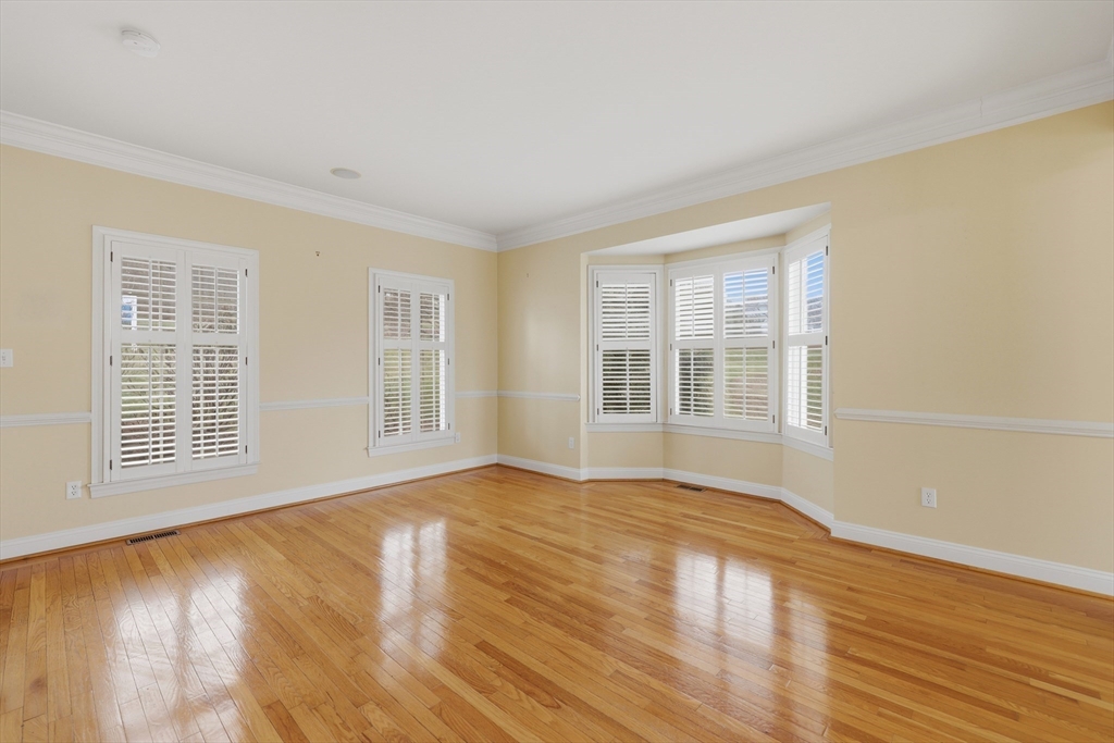 35 Peter Street Holliston, MA 01746 - Photo 7 of 42 a view of an empty room with wooden floor and a window
