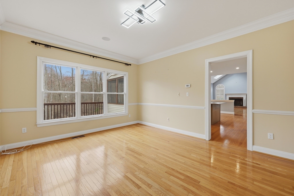 35 Peter Street Holliston, MA 01746 - Photo 8 of 42 wooden floor in an empty room with a window