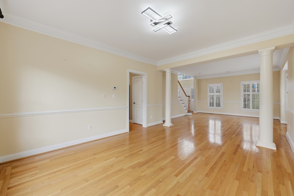 35 Peter Street Holliston, MA 01746 - Photo 9 of 42 a view of empty room with wooden floor and fan