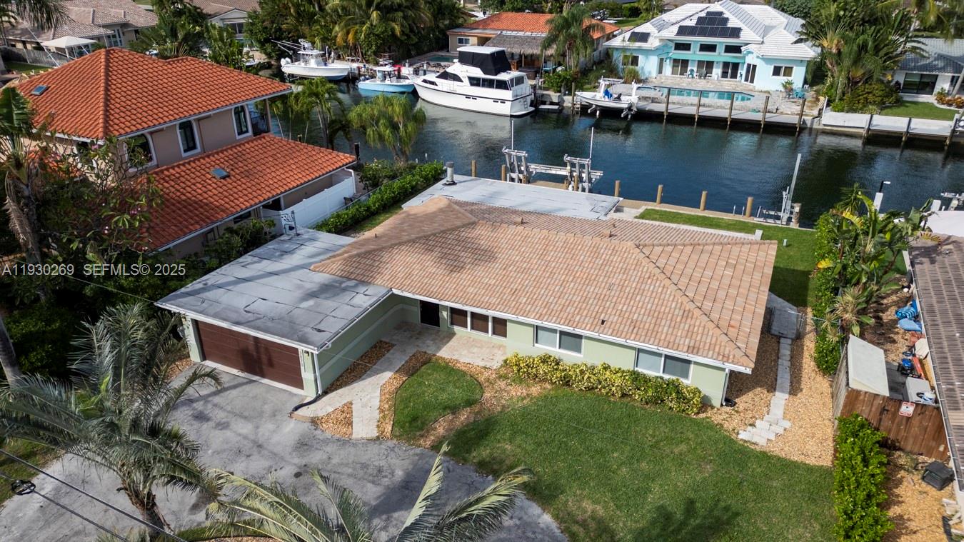 2875 Northeast 19th Street Pompano Beach, FL 33062 - Photo 23 of 79 an aerial view of a house with swimming pool and outdoor seating