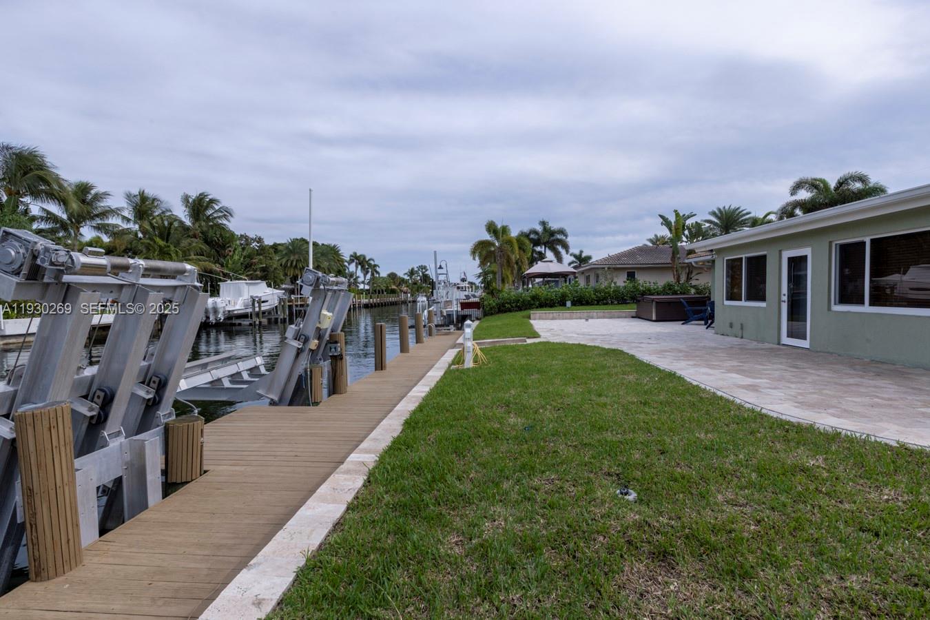 2875 Northeast 19th Street Pompano Beach, FL 33062 - Photo 36 of 79 a view of a house with a yard porch and sitting area