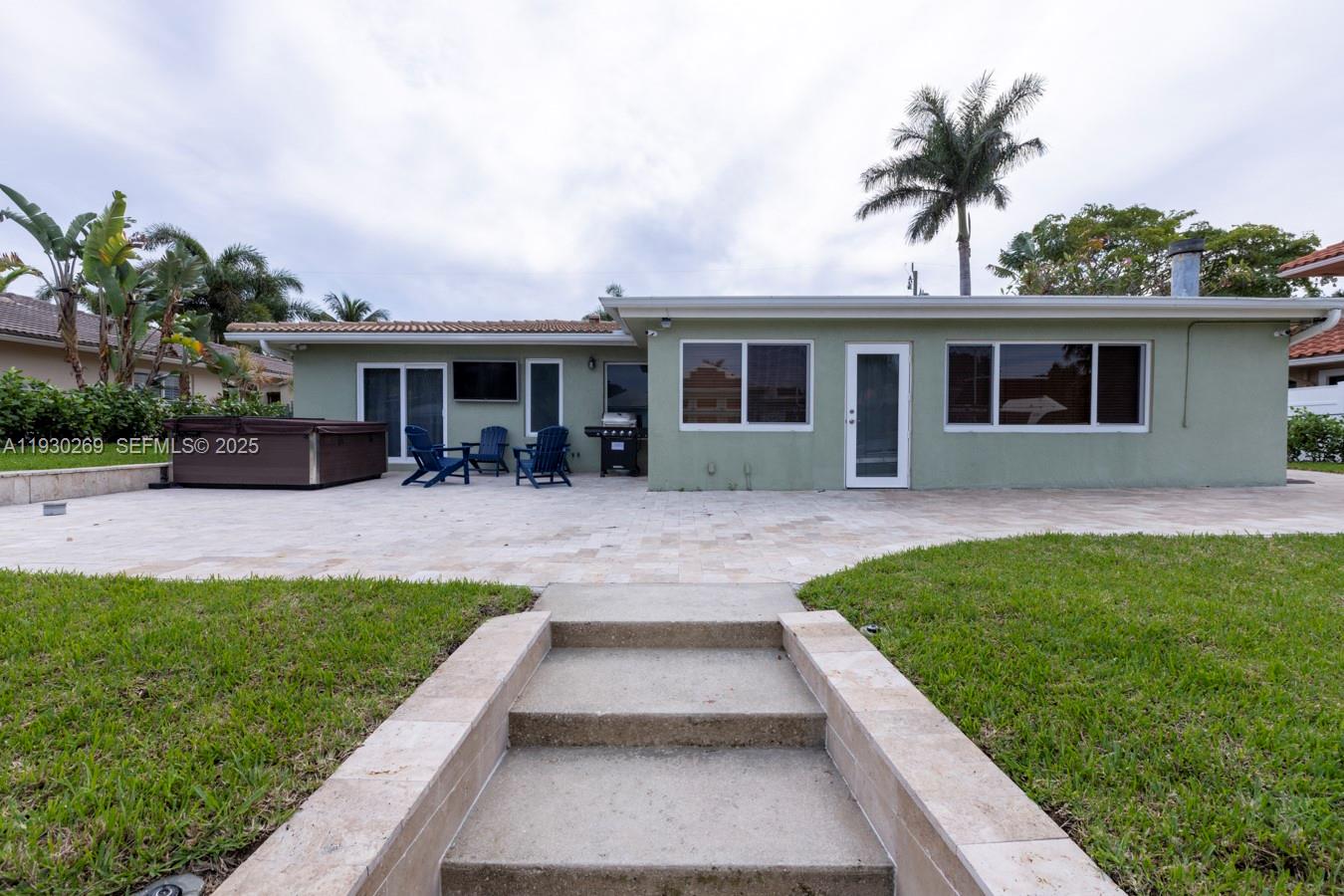 2875 Northeast 19th Street Pompano Beach, FL 33062 - Photo 38 of 79 a front view of house with yard and green space