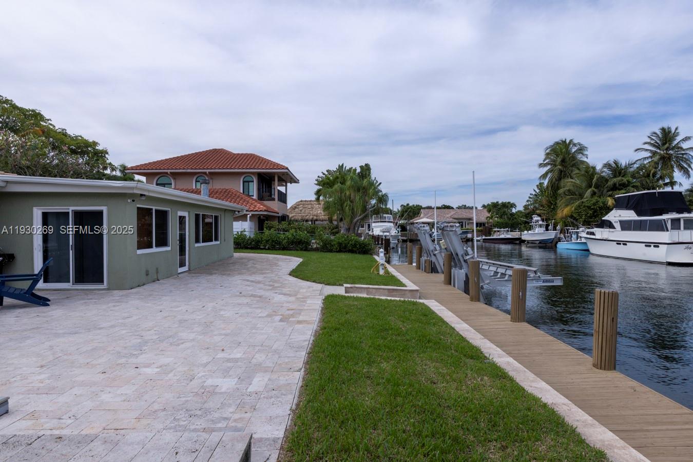 2875 Northeast 19th Street Pompano Beach, FL 33062 - Photo 41 of 79 a view of a house with backyard porch and sitting area
