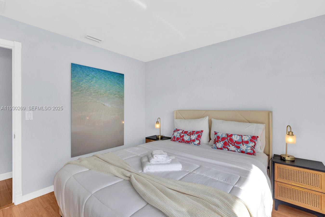 2875 Northeast 19th Street Pompano Beach, FL 33062 - Photo 56 of 79 a bedroom with a bed and a table