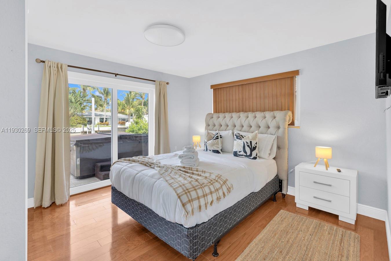 2875 Northeast 19th Street Pompano Beach, FL 33062 - Photo 57 of 79 a bedroom with a bed and a dresser