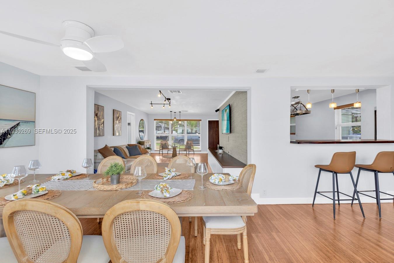 2875 Northeast 19th Street Pompano Beach, FL 33062 - Photo 69 of 79 a view of a dining room with furniture and wooden floor