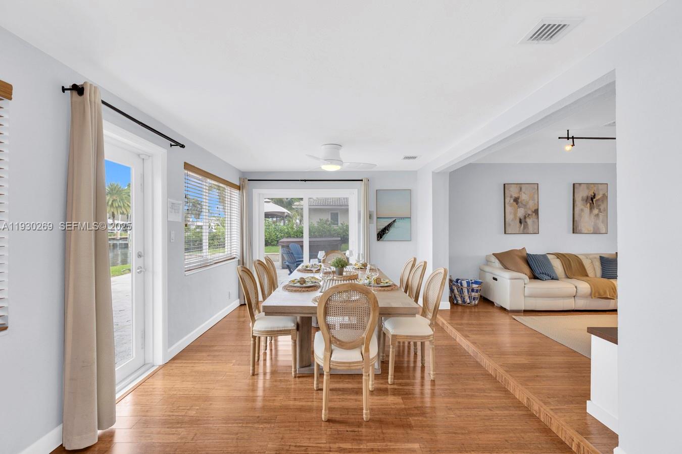 2875 Northeast 19th Street Pompano Beach, FL 33062 - Photo 71 of 79 a view of a dining room with furniture window and wooden floor