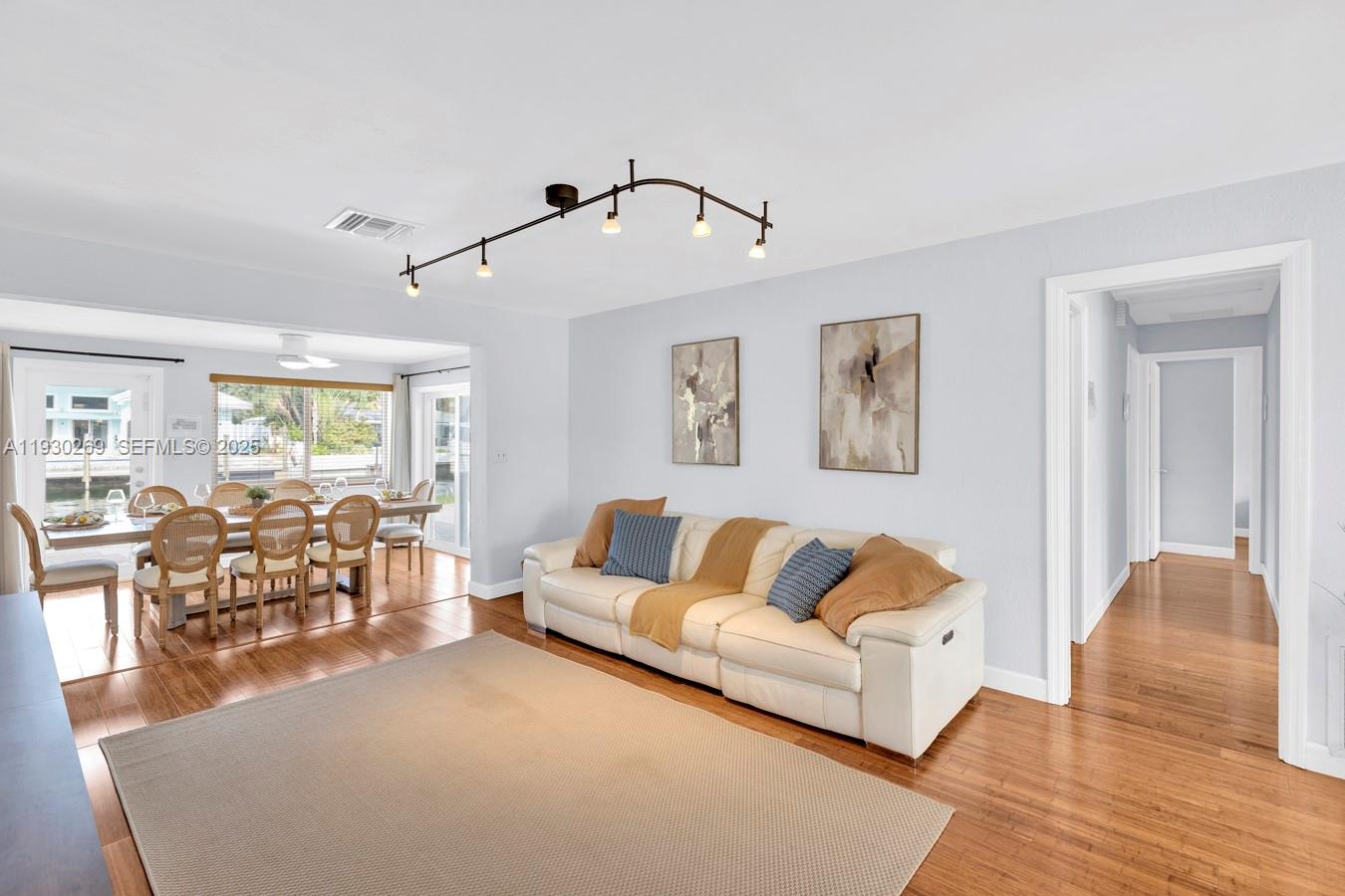 2875 Northeast 19th Street Pompano Beach, FL 33062 - Photo 73 of 79 a living room with furniture and wooden floor