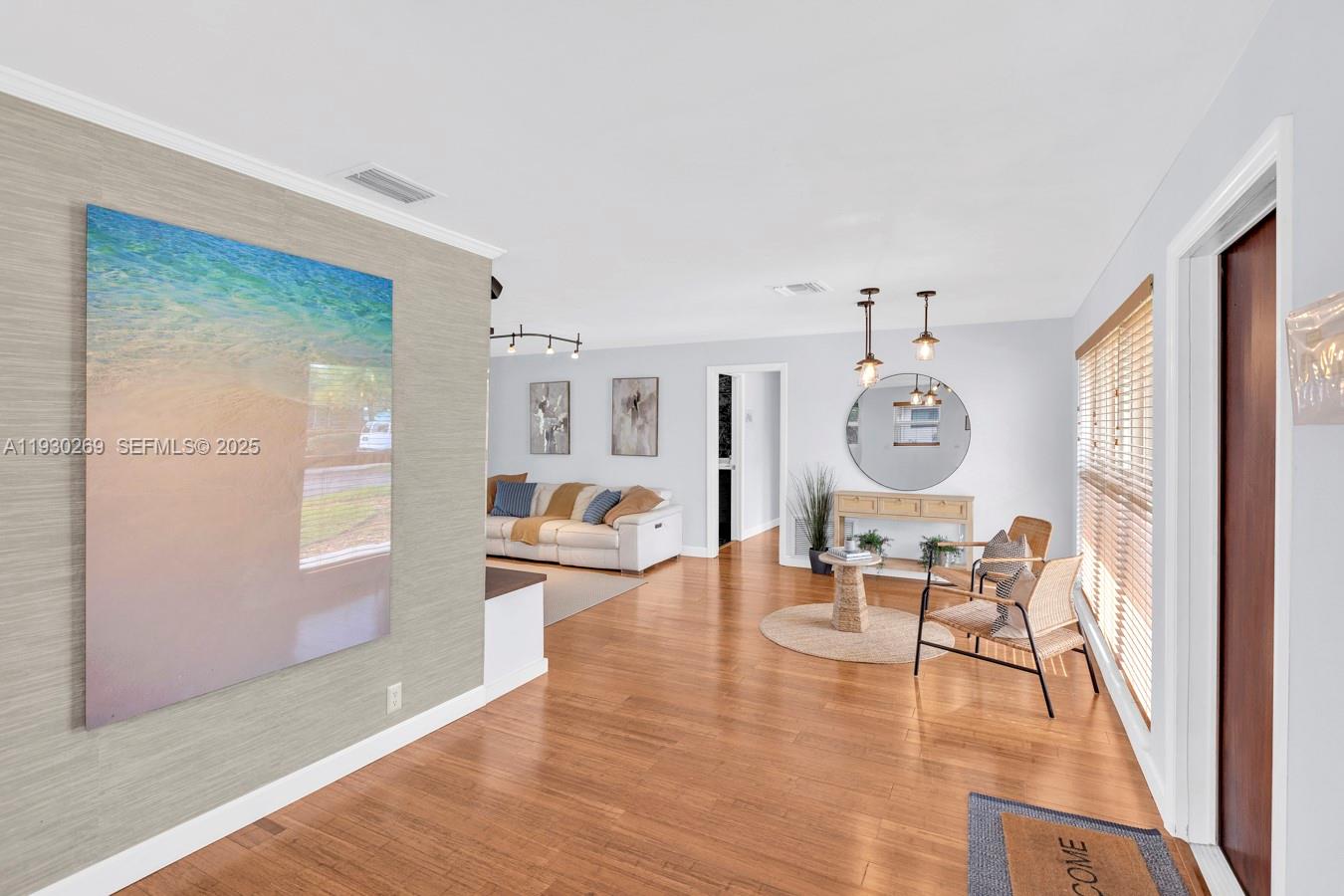 2875 Northeast 19th Street Pompano Beach, FL 33062 - Photo 74 of 79 a living room with furniture and a wooden floor