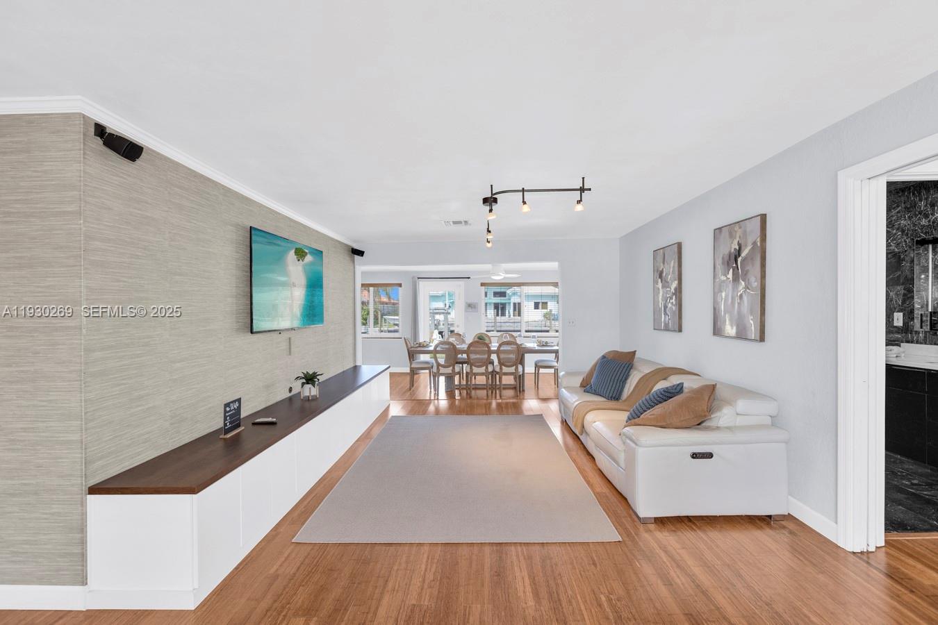 2875 Northeast 19th Street Pompano Beach, FL 33062 - Photo 77 of 79 a living room with furniture and a flat screen tv