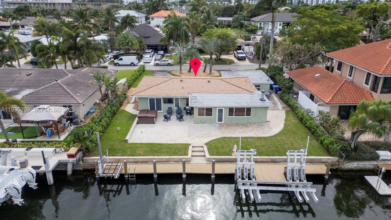 2875 Northeast 19th Street Pompano Beach, FL 33062 - Photo 8 of 79 a aerial view of multiple houses with a yard