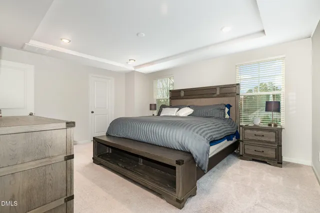 a bedroom with a bed and a cabinets